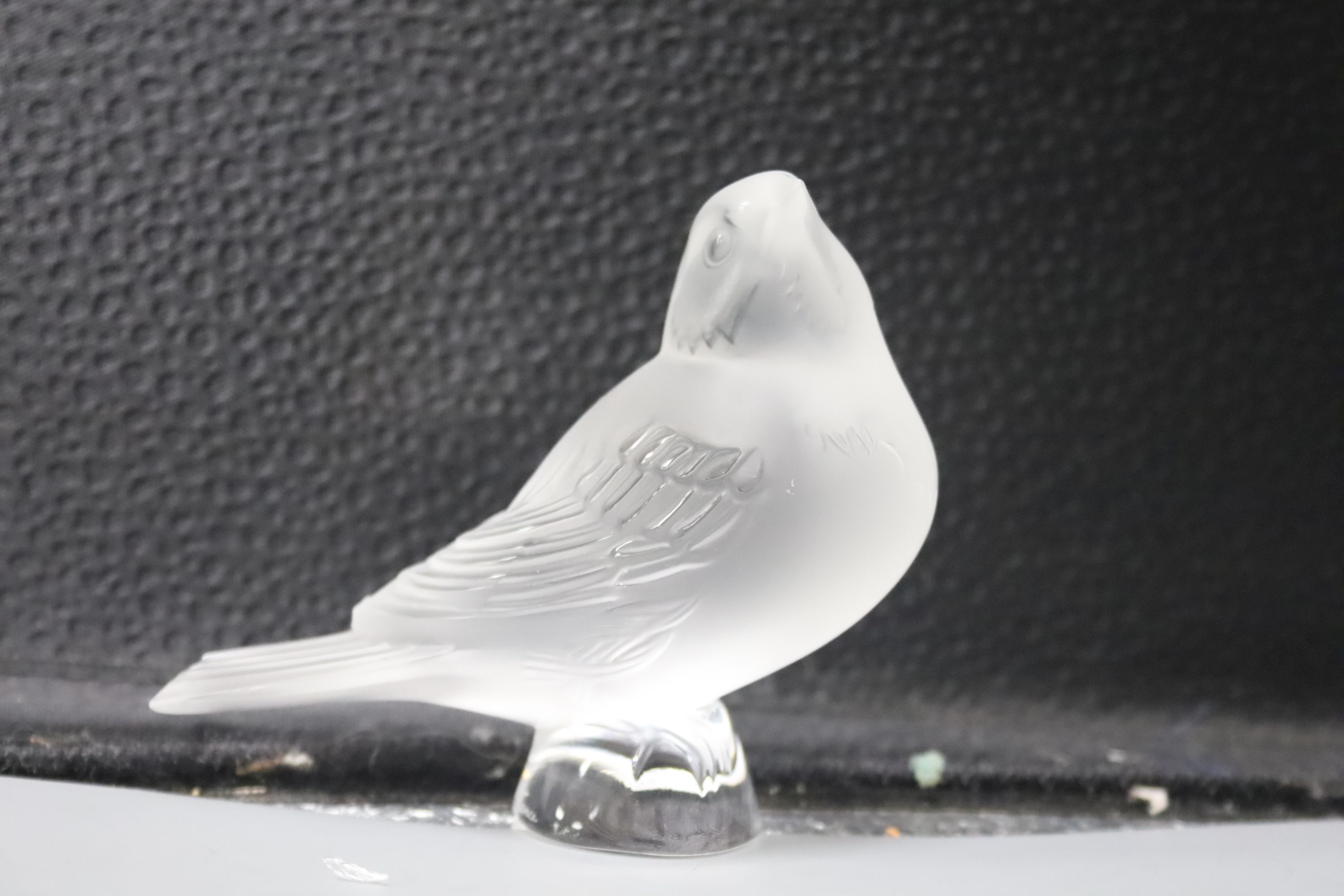 A Lalique 'Nogent' bowl and two frosted glass models of birds, 'Singing Robin' and 'Worried Robin'